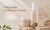 Three skincare products from Meen Metics are arranged on a stone slab with soft pink fabric and dried flowers. The products include a jar of Brightening Cicuta cream, a pump bottle of Under Arm Odour Serum, and a matching under arm odour serum box.